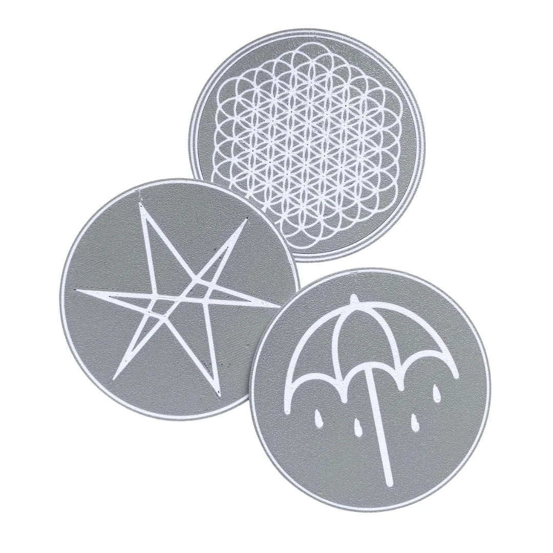 Coasters in relief, 3D printed in grey and white PLA, based on music album covers