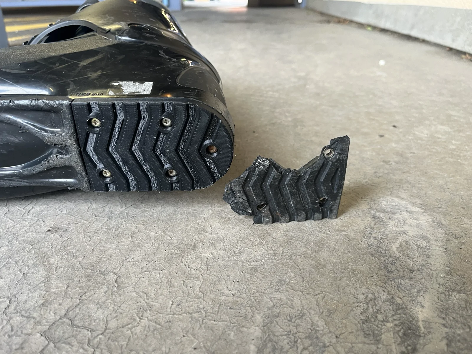 Broken ski boot heel pad next to its 3D printed replacement, before and after